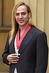 John Galliano, British designer for the French fashion house Dior, poses 27 November 2001 after receiving a Commander of the British Empire award from Queen Elizabeth II at Buckingham Palace in London. He said it was one of the greatest honors he had ever had, and that he was very proud.,Image: 69223754, License: Rights-managed, Restrictions:, Model Release: no, Credit line: FIONA HANSON/AFP/Profimedia