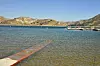 PIRU, CALIFORNIA - JULY 09: Boats are docked and one is roped off with police tape (upper right) at Lake Piru, where actress Naya Rivera was reported missing Wednesday, on July 9, 2020 in Piru, California. According to the Ventura County Sheriff’s Department this is believed to the boat that was rented by Rivera. Rivera, known for her role in