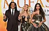 Glazbeni mogul Jay-Z sa suprugom Beyonce i kćeri Blue Ivy Carter čije su večernje haljine, primjerenije odraslim ženama, postale uobičajena pojava