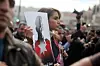 AMMAN, JORDAN- FEBRUARY 06: Queen Rania of Jordan participates in a mass demonstration after Friday prayers near Al Hussein Mosque to express her solidarity with the pilot murdered by the Islamic State (IS) group earlier this week, on February 6, 2015 in Amman, Jordan. Muath al-Kasaesbeh was captured by the terror group after crashing his plane near Raqqa in northern Syria, during a mission against IS in December. (Photo by Jordan Pix/ Getty Images)