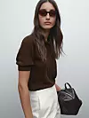 Massimo Dutti rupičasti pulover od mješavine pamuka (59,95 eura)