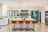 Los Angeles, CA - Prince Harry and Meghan Markle eyeing Kylie Jenner’s former Malibu rental house. Although they’re currently bunking up in a million Vancouver mansion, it’s long been widely speculated that the ex-royals eventually plan to settle in Los Angeles, where Markle was raised and where her mother, Doria Ragland, still resides. The residential rumours intensified when reports emerged that Harry and Markle are keen on one particular Malibu house: a hulking, European-style mansion known as Petra Manor, tucked away within an exclusive guard-gated community. Reports have the home worth between million and million. Malibu’s Petra Manor was once home to the biggest influencers of them all — 22-year-old lip kit tycoon Kylie Jenner, who rented the house over the summer 2018. Jenner bunked up there with her ex-bestie, fellow influencer Jordyn Woods, and a then-newborn Stormi Webster. Petra Manor was custom-built in 2015 by David Charvet and Brooke Burke, on land that they originally purchased from Mel Gibson. The giant house still appears to be jointly owned by the now-divorced couple, though they do not reside there, and the property has long serviced as a high-priced rental home for visiting billionaires and foreign dignitaries seeking a brief taste of Malibu’s legendary sunshine. The house is located within Serra Retreat, one of Malibu’s few guard-gated communities and arguably the city’s most private enclave — tucked into the canyon-side foothills and bordered by rugged open land, but still just a quick jaunt to the trendy shops and restaurants in downtown Malibu. Although it’s hidden away within that securely guard-gated community, the property itself is also walled and gated for ultimate peace of mind. Surrounded by mature oak and sycamore trees, the stone manor spans more than 12,000 sq ft of living space, with 8 bedrooms and a whopping 10 bathrooms — ample space for a young family and plenty of attitude. Inside, there’s a double-height foyer with a grand staircase, a marble-topped wet bar, professional-style screening room, eat-in kitchen with top-of-the-line stainless appliances and a wine cellar capable of storing hundreds of bottles. Other features include massive living and family rooms, both outfitted with fireplaces, an upstairs master with a spa-style bath and private balcony, and even an at-home dance studio. Outdoors, there’s mature olive trees, formal gardens, outdoor lounge, resort-style swimming pool with Baja shelf. *BACKGR BACKGRID UK 24 FEBRUARY 2020, Image: 500637744, License: Rights-managed, Restrictions: RIGHTS: WORLDWIDE EXCEPT IN UNITED STATES, Model Release: no, Credit line: VRBO / BACKGRID / Backgrid UK / Profimedia
