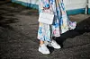 COPENHAGEN, DENMARK - FEBRUARY 01: Aylin Koenig wearing Vetements dress, Alexander McQueen sneaker, Acne beanie, Valentino bag during the Copenhagen Fashion Week Autumn/Winter 18 on February 1, 2018 in Copenhagen, Denmark. (Photo by Christian Vierig/Getty Images)