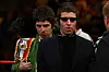 LAS VEGAS - NOVEMBER 22: Noel and Liam Gallagher of Oasis bring out boxer Ricky Hatton of England's belts before taking on Paulie Malignaggi during their light-welterweight fight at the MGM Grand Garden Arena November 22, 2008 in Las Vegas, Nevada. (Photo by John Gichigi/Getty Images)