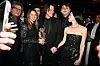 Jim Carrey s partnericom Minom, kćeri Jane i unukom Jacksonom u crnim svečanim odjevnim kombinacijama.