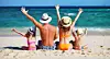 happy family father, mother and children backs on the beach at sea
