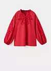 Rupičasta izvezena bluza - prije 69,99 eura, sada 45,99 eura