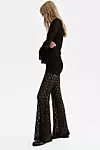 Flared lace-look trousers - 29,99 eura