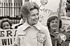 Conservative activist Phyllis Schlafly wearing a ''Stop ERA' ' badge demonstrating with other women against the Equal Ri ghts Amendment in front of the White House Washington D.C. Feb. 4 1977. Feb. 4 1977. Feb. 4 1977.